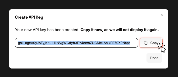 Created API Key dialog showing the new key with a Copy button and a one-time-display warning